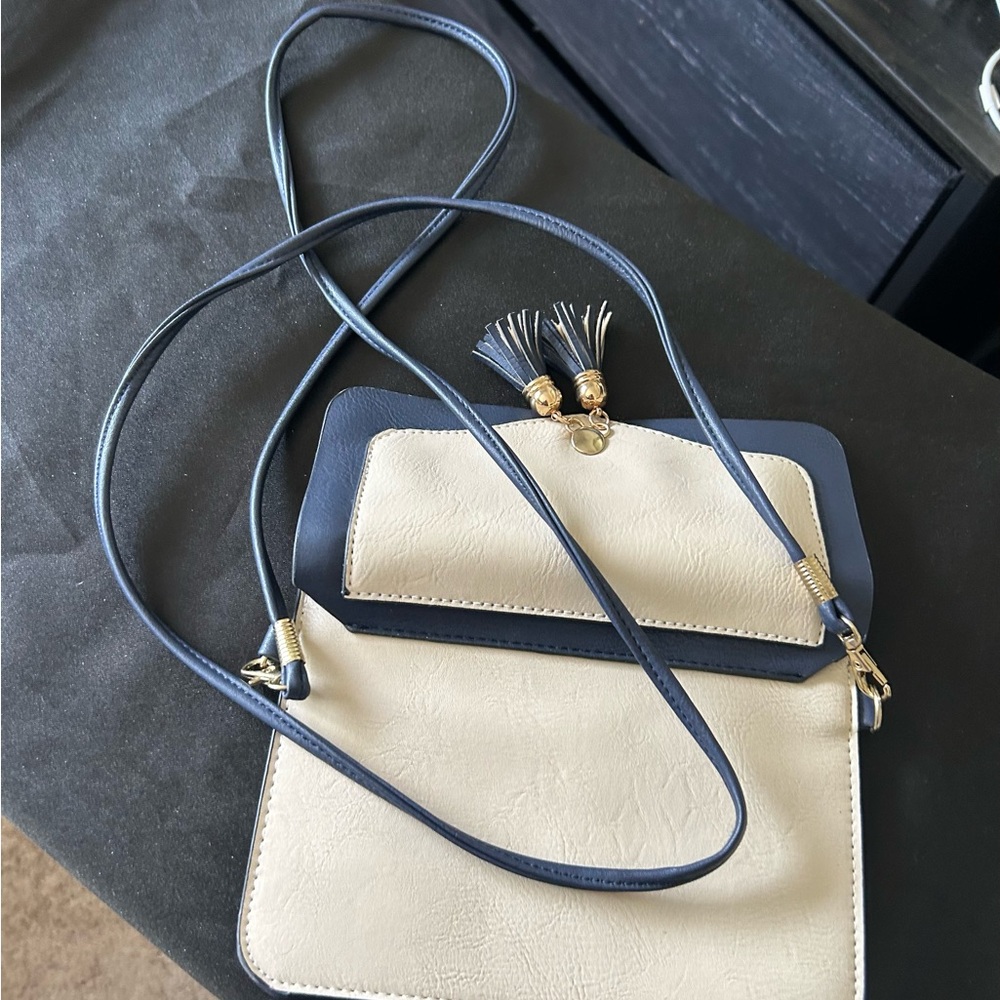 Urban energy Chic Cream and Blue Crossbody Bag with Gold Clasp
Like new